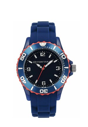 Blue wristwatch with red bezel, silver hour markers, and hands, displaying 10:10:30, with a blue silicone strap and "Tom Tailor" logo on dial.