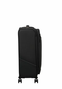 Black suitcase with a textured finish, sleek rectangular shape, dual wheels, and a zippered compartment. Notable for its minimalist design.