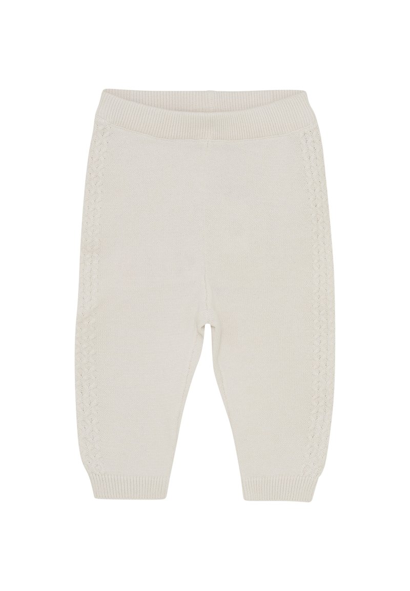 Legging pour bébé en tricot de couleur crème, avec une taille côtelée, des motifs texturés sur les côtés et des poignets de jambe fuselés. Tissu doux.