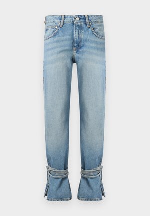 Light blue denim jeans with high waist, straight legs, and cords tied around the ankles creating gathers and openings at the hems.