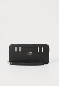 Black textured leather wallet with a zip closure, featuring three metallic accents and a logo inscription in gold. Includes a wrist strap.