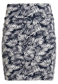 Jupe bleu marine avec motif de feuilles tropicales blanches, style ajusté, taille haute, longueur au genou.