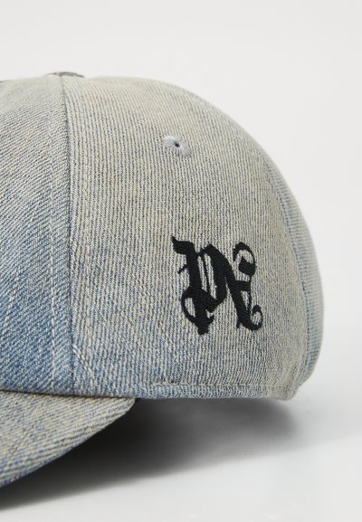 Casquette de baseball en denim, bleu clair, avec logo noir brodé. Couronne structurée, visière courbée et détails de couture sur les coutures.