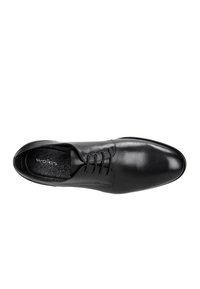 Scarpe eleganti in pelle nera con finitura liscia, punta semplice e allacciatura a sei occhielli. L'interno presenta una morbida fodera e una soletta con il marchio.
