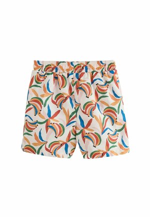Valged lühikesed püksid elastse vööpiiriga, millel on värvikad abstraktsed banaani- ja lehemustrid punases, sinises, rohelises ja oranžis värvitoonis.