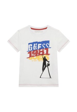 T-shirt bianca in cotone a maniche corte, con una stampa grafica audace in blu, rosso e giallo, e la silhouette di una figura su una scala.