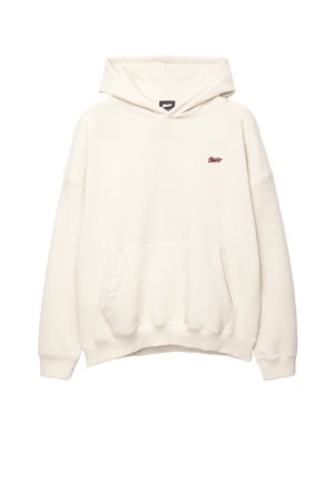 Cremefarbener Kapuzenpullover, Kängurutasche, lockere Passform, gerippte Bündchen und Saum, kleines rotes Logo auf der oberen linken Brustseite.