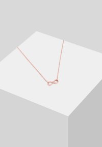 Rosen-gul halskæde med et uendelighedssymbol vedhæng. Kæden er delikat med en glat tekstur, der fremhæver vedhængets design.