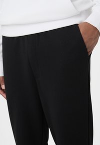 Fila APPAREL JOVENCAN SLIM CROPPED SMART  - Trainingsbroek - black