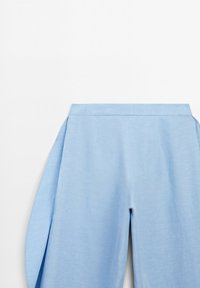 Light blue wide-leg pants with a high waistband, smooth fabric, and no visible fasteners on a white background.