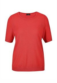 Rode gebreide t-shirt met een ronde halslijn en korte mouwen. Heeft een relaxte pasvorm en ribbeltextuur aan de onderrand en mouwranden.