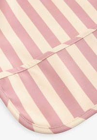 Pink and cream striped fabric with a smooth texture, featuring a rounded edge and stitching detail along the border.