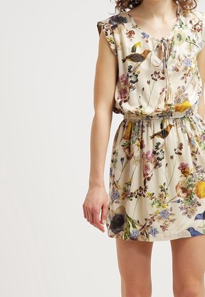 Ärmelloses cremefarbenes Kleid mit elastischem Bund, floralem und Vogelmotiv sowie einer kleinen vorderen Schleife mit Quasten.