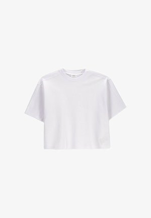 Biały, oversize krótki crop top z okrągłym dekoltem, pokazany na jednolitym białym tle.