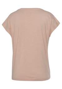 Pale pink short-sleeve t-shirt, soft jersey material, relaxed fit, rounded neckline, and no visible patterns or accents.