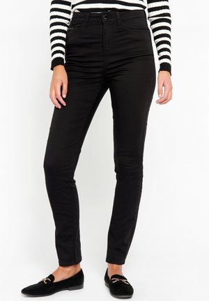 Zwarte katoenen broeken hebben een aansluitend ontwerp met een knoopsluiting en zijzakken, aangevuld met een soepele textuur en een gestructureerde silhouet.