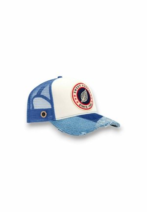 Casquette de camionneur en maille bleue et blanche avec une visière en denim et un patch circulaire indiquant "Sweet Pants Since 1984" avec un emblème de feuille.