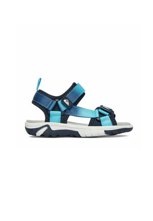 Blå og marineblå udendørs sandal med justerbare stropper og en robust hvid og sort sål, vist fra siden på en hvid baggrund.