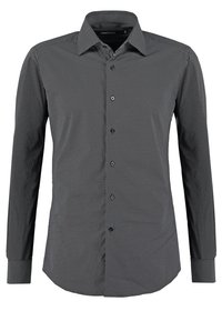 Chemise homme à manches longues avec un petit motif géométrique noir et blanc et col pointu.