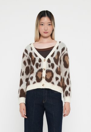 Leopard print cardigan featuring a soft, fluffy texture, V-neck, button closure, and ribbed hem. Colors include cream, brown, and beige accents.