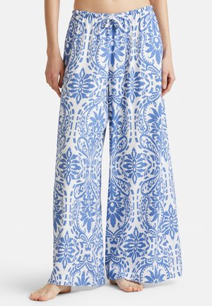 Pantalones de pierna ancha en tejido ligero con un intrincado patrón floral en azul y blanco. Presentan una cinturilla elástica con cordón.