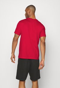 Nike Performance CREW SOLID - T-shirt desportiva - gym red/white