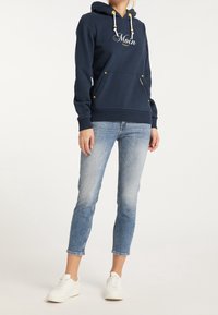 Navy blue hoodie with white drawstrings and yellow accents, featuring a front pocket and the word "Moin" embroidered across the chest.