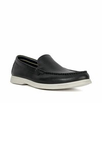 Black leather slip-on shoe with a textured finish, stitched accents, and a light-colored rubber sole. Simple, rounded design.