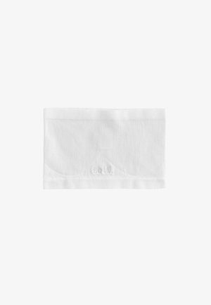 White ribbed fabric headband with a scalloped design and subtle logo detail. Smooth texture, elastic material for stretch and comfort.