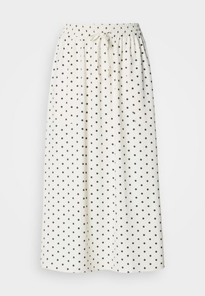 Fehér midi szoknya fekete pöttyökkel, elasztikus derékpánttal és húzózsinórral. Könnyű anyagból készült, légies szabással.