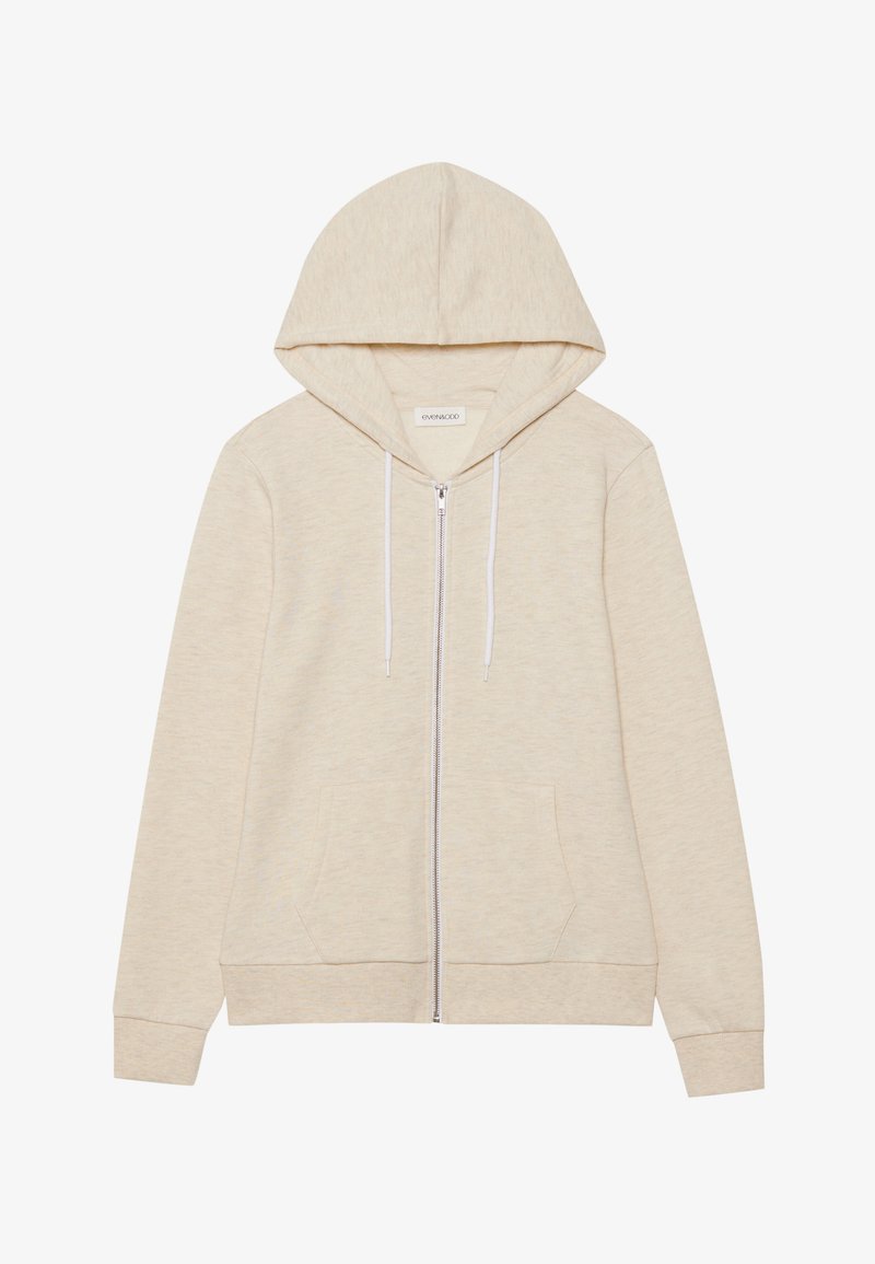 Sudadera con cremallera en un tono beige claro, hecha de una tela suave, con capucha ajustable, dos bolsillos frontales y puños acanalados.