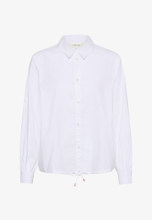 Hvid langærmet skjorte med knapper, krave og snøre i underkanten, med en mærkat mærket "CREAM" indvendigt i kraven.