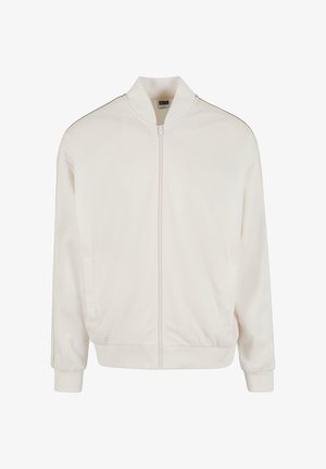 Vit bomberjacka med dragkedja, ribbad krage och ärmslut, samt sidofickor. Slät, lätt tyg med minimal detaljer.