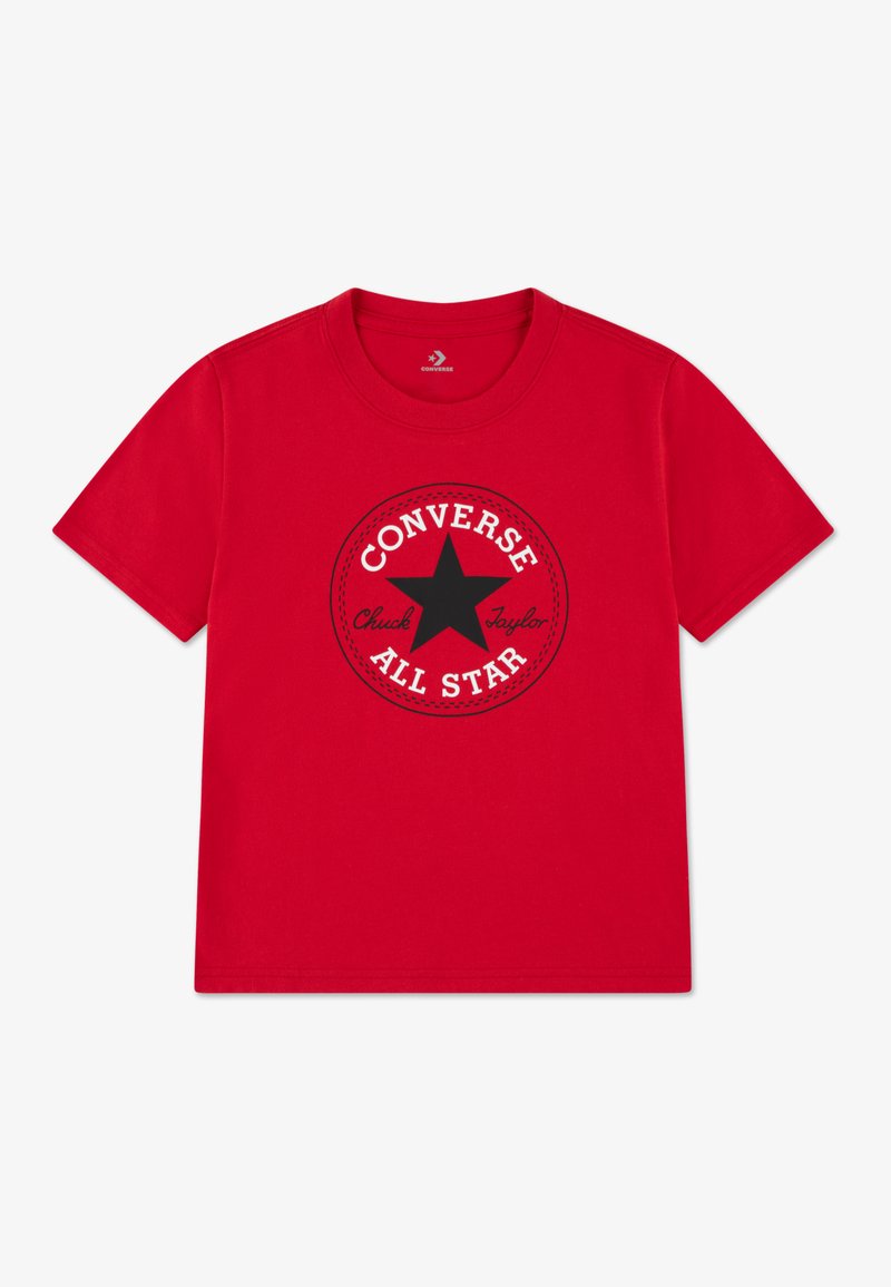 T-shirt en coton rouge avec un motif circulaire noir comprenant une étoile et le texte "CONVERSE ALL STAR", col rond et manches courtes.