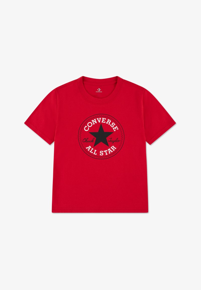 T-shirt en coton rouge avec un motif circulaire noir comprenant une étoile et le texte "CONVERSE ALL STAR", col rond et manches courtes.