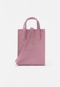 Pink faux leather tote bag with short handles, detachable strap, and silver embossed logo on the front. Square shape with smooth texture.
