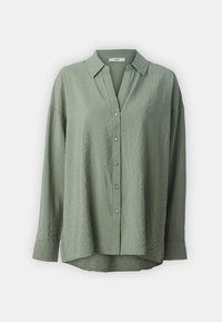 Camisa de botão de manga longa, verde-claro, com um acabamento texturizado, gola e uma bainha ligeiramente curvada. Apresenta botões da mesma cor.