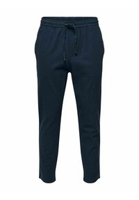 Granatowe spodnie dresowe wykonane z miękkiego materiału, z elastycznym pasem w talii i sznurkiem, zwężanymi nogawkami oraz bez widocznych kieszeni.