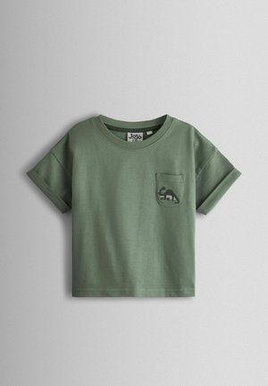 Zelené bavlnené tričko s krátkym rukávom, okrúhlym výstrihom a zrolovanými manžetami. Má vrecko s potlačou dinosaura.