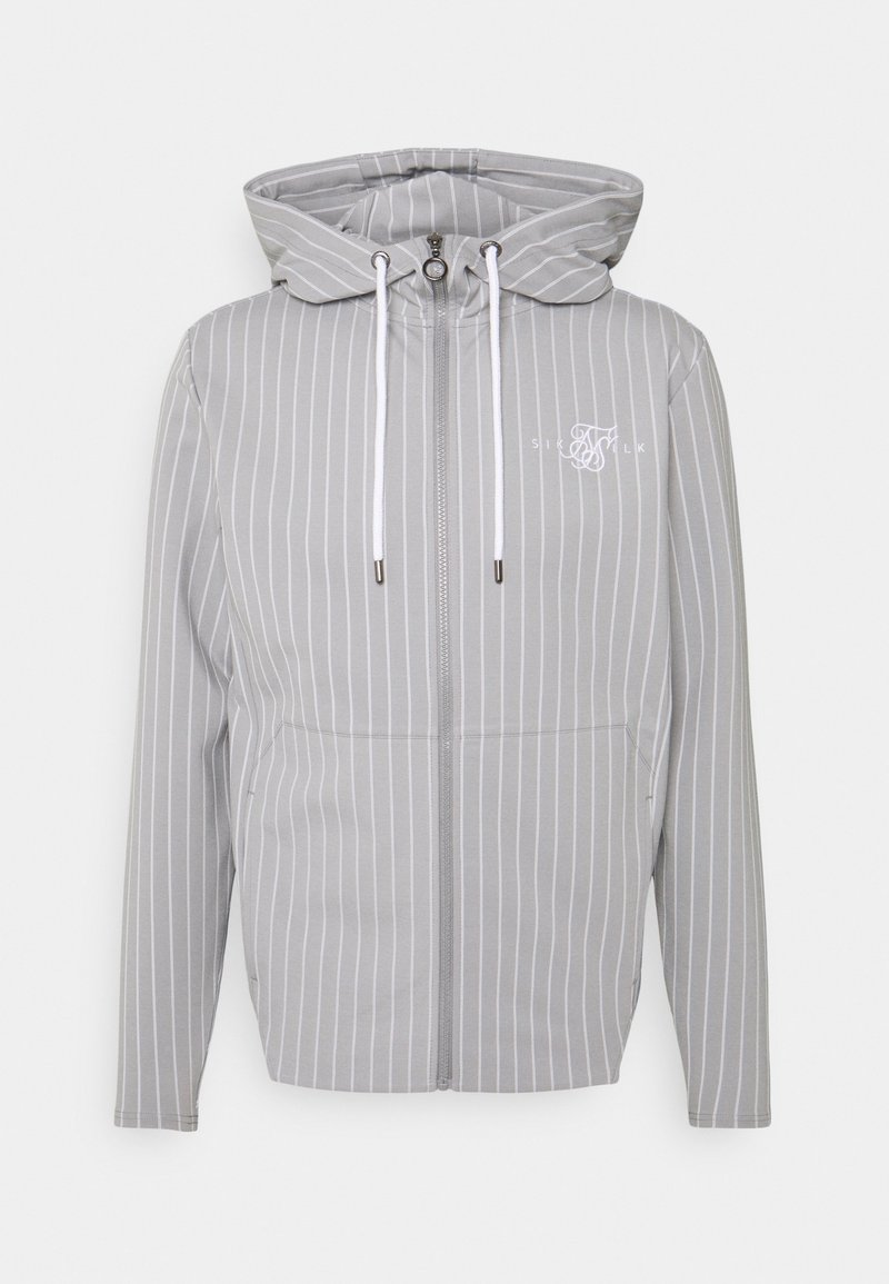 Grijze zip-up hoodie met witte strepen, verstelbare capuchon met trekkoorden, voorzakken en een logo detail op de borst.