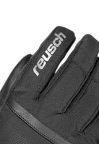 Schwarze Handschuhe aus Stoff mit strukturierten Akzenten. Enthält das "reusch"-Logo in Silber an der Oberseite und ein glattes schwarzes Feld in der Nähe des Handgelenks.