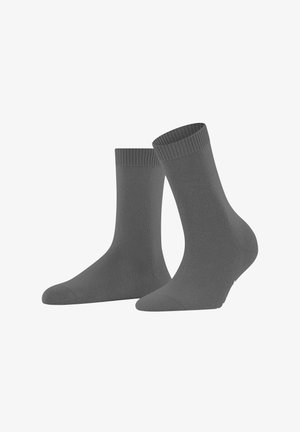 Une paire de chaussettes grises unies mi-mollet avec des ourlets côtelés, présentée sur un fond blanc.