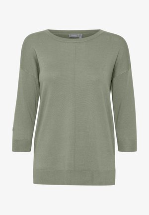 Gaiši zaļš garām piedurknēm džemperis ar brīvu piegriezumu, apaļu izgriezumu, ribotu aproču un gludu virsmu. Iezīmē centrālo vīļu detaļu.