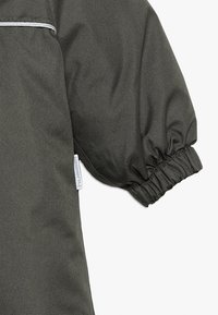 Hummel HMLSNOOPY - Kombinezon zimowy