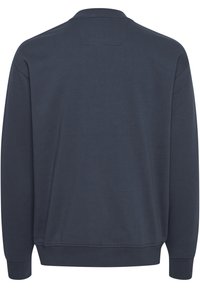 Sudadera de manga larga azul marino con puños y dobladillo acanalados, mostrada desde la parte de atrás sobre un fondo blanco.