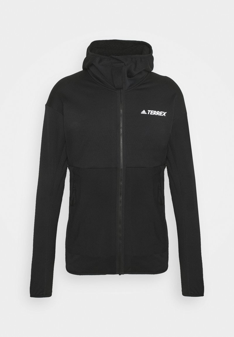 Veste noire Adidas Terrex à fermeture éclair avec capuche, manches longues et deux poches latérales zippées, présentée sur un fond uni.