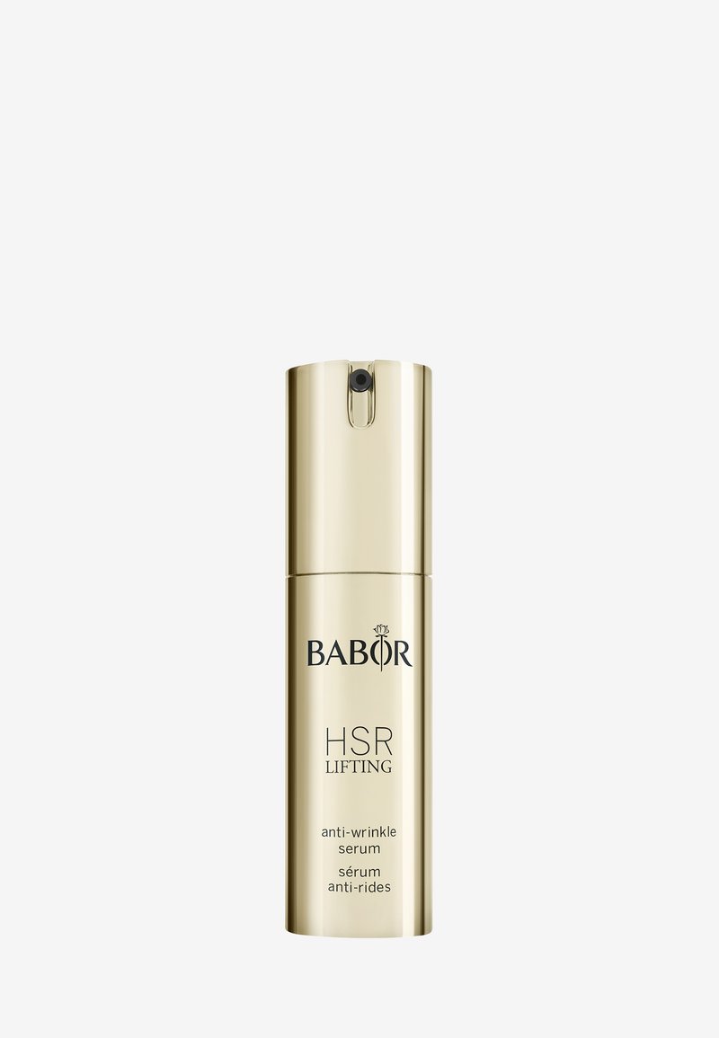 Bouteille en métal doré avec un bouchon à pompe. L'étiquette comporte "BABOR HSR LIFTING" et "sérum anti-rides" en texte noir. Surface lisse et réfléchissante.