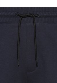 HUGO DIZ - Tracksuit bottoms - dark blue