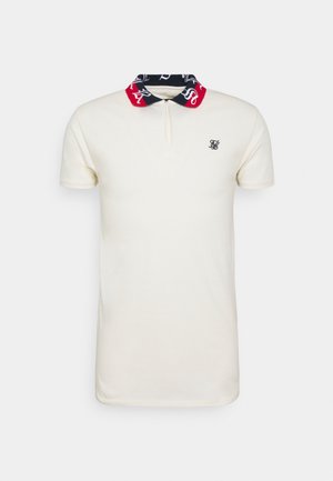 Weißes Poloshirt mit kurzen Ärmeln und marineblau-rotem Kragen mit weißer Schrift, Reißverschluss vorne und kleinem schwarzen gesticktem Logo auf der Brust.