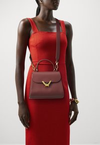 Coccinelle DEW - Handbag - bordeaux